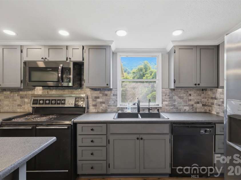 8162 Nc 16 Highway, Moravian Falls, NC 28654.  MLS# CAR4410384, YatesRealty ID 42188. Window with views over the sink