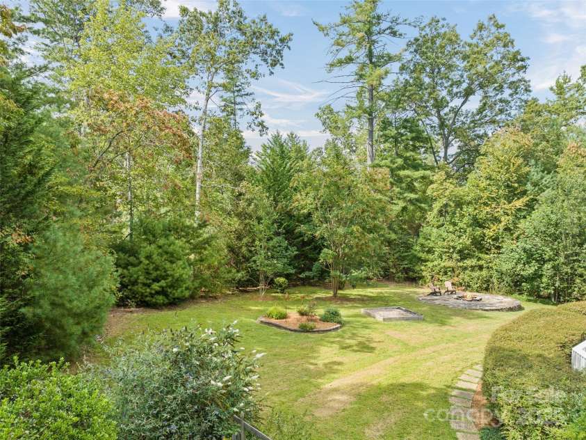 6 Dogwood Lane, Fletcher, NC 28732.  MLS# CAR4302762, YatesRealty ID 4219. Gardens and Firepit