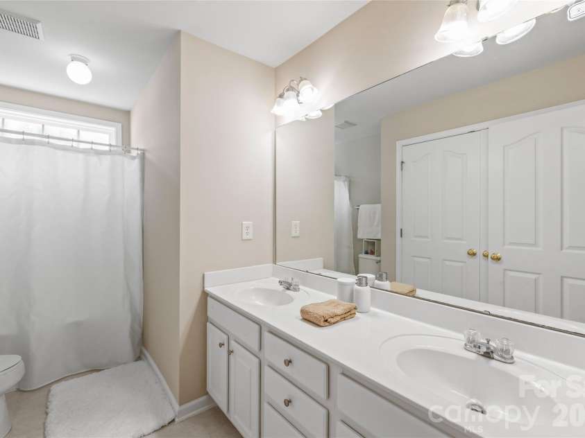 1906 Birchbrook Court, Harrisburg, NC 28075.  MLS# CAR4399963, YatesRealty ID 42202. Guest full bath on second floor with dual sinks