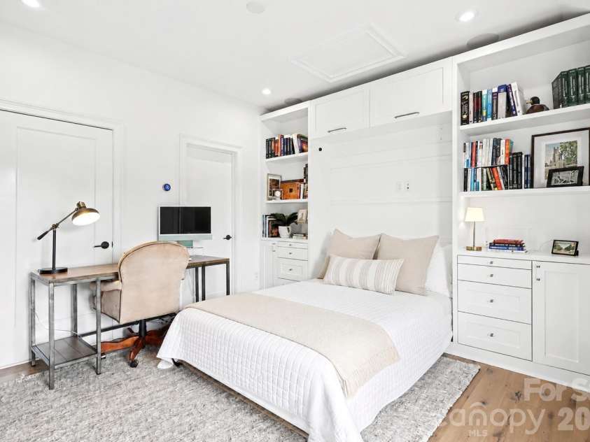 2505 Kenmore Avenue, Charlotte, NC 28204.  MLS# CAR4411346, YatesRealty ID 42206. This Murphy bed features custom built-in side tables that seamlessly extend directly from the integrated storage drawers.