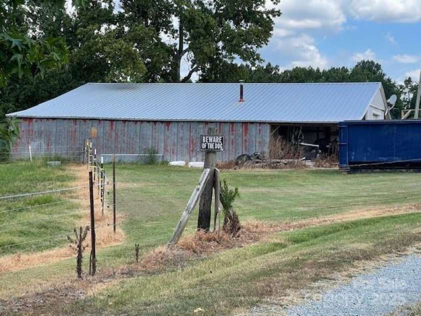 3513 Gilboa Road, Marshville, NC 28103.  MLS# CAR4283541, YatesRealty ID 4222. Side view of the workshop