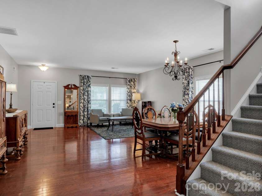 4908 Cruz Bay Drive, Monroe, NC 28110.  MLS# CAR4409228, YatesRealty ID 42226. Sunlit living space with a graceful staircase