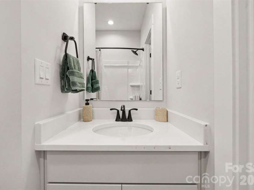 1607 Polk Street, Charlotte, NC 28206.  MLS# CAR4404175, YatesRealty ID 42227. First Floor En-Suite Bathroom