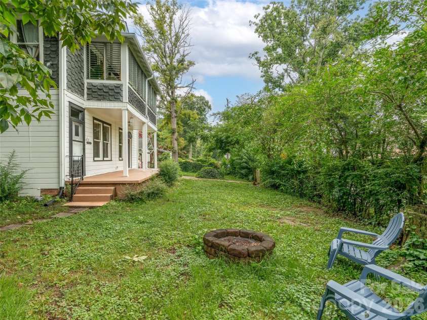111-113 Stewart Street, Hendersonville, NC 28792.  MLS# CAR4410285, YatesRealty ID 42230. Fire Pit in Main Front Yard