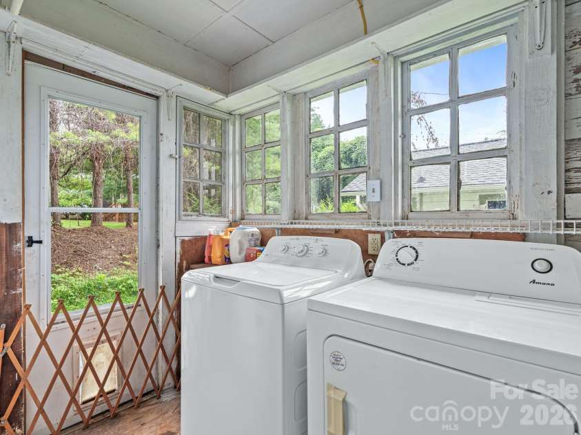111-113 Stewart Street, Hendersonville, NC 28792.  MLS# CAR4410285, YatesRealty ID 42230. Lower Level Laundry off Kitchen