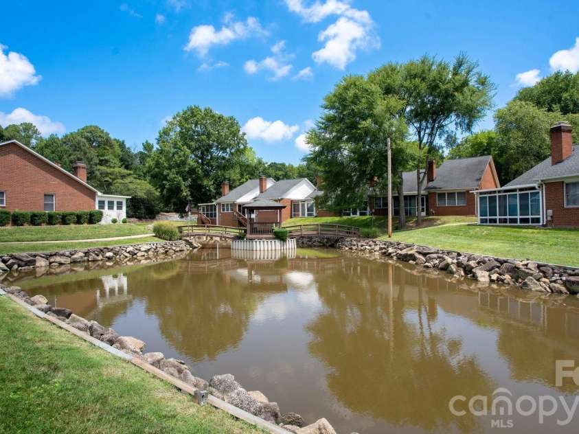 19940 Oak Leaf Circle, Cornelius, NC 28031.  MLS# CAR4410513, YatesRealty ID 42233. A coveted pond view from the screened-in porch
