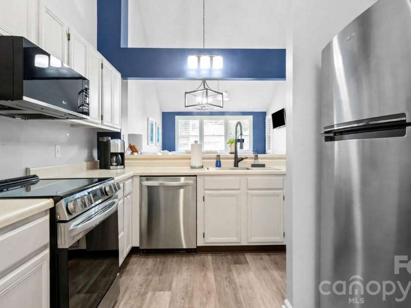 19940 Oak Leaf Circle, Cornelius, NC 28031.  MLS# CAR4410513, YatesRealty ID 42233. Virtually staged with white cabinets