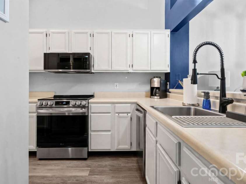 19940 Oak Leaf Circle, Cornelius, NC 28031.  MLS# CAR4410513, YatesRealty ID 42233. Virtually staged with white cabinets