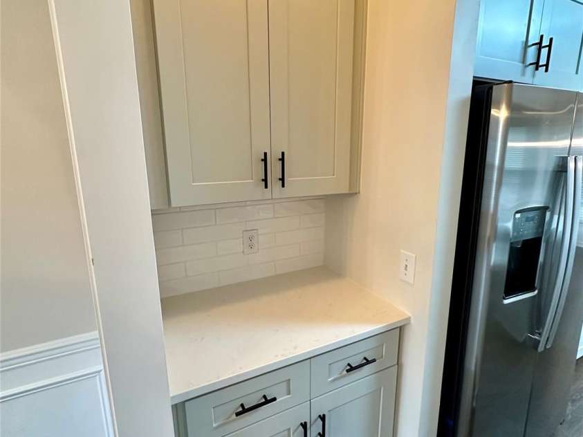 7633 Rathburn Lane, Charlotte, NC 28277.  MLS# CAR4296368, YatesRealty ID 42242. Brand new cabinets, SS appliances, quartz counters, backsplash, and LVP flooring.