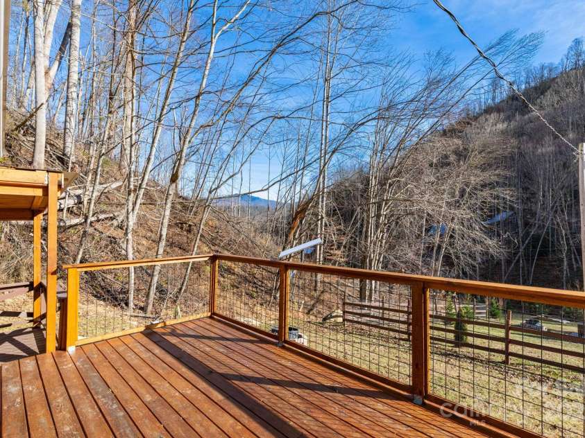 1010 & 1014 Melton Branch Road, Bakersville, NC 28705.  MLS# CAR4334266, YatesRealty ID 4225. Barndominium Front Deck with Mountain Views