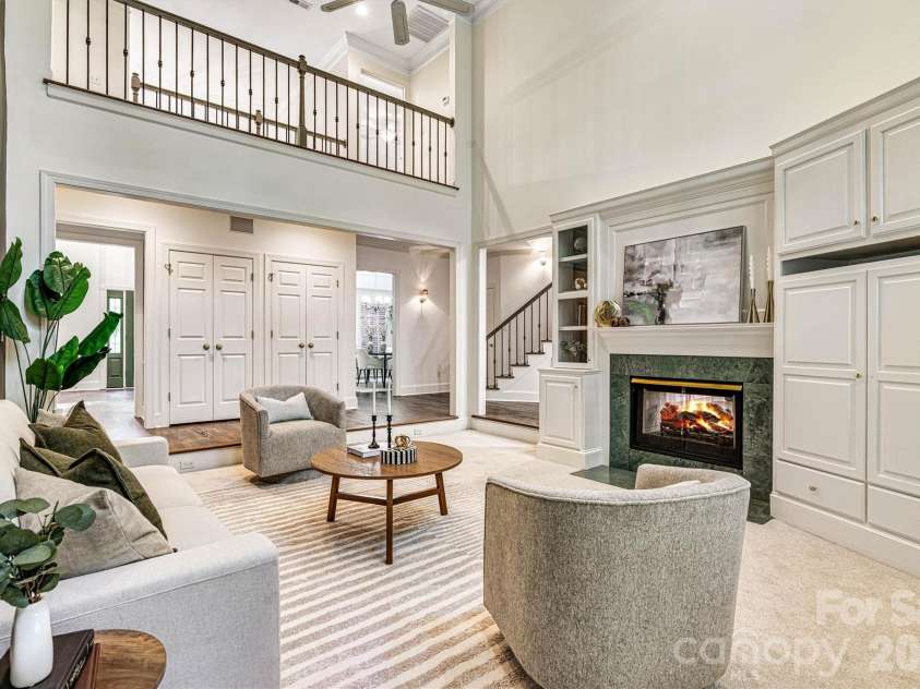 5321 Saddlewood Lane, Mint Hill, NC 28227.  MLS# CAR4403037, YatesRealty ID 42254. Timeless architecture is highlighted by the open catwalk, while the two-sided fireplace framed by custom built-ins anchors the room.