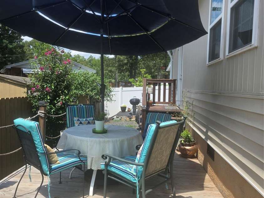 110 Twin Bluff Trail, Mount Gilead, NC 27306.  MLS# CAR4409542, YatesRealty ID 42258. Deck left side of dwelling
