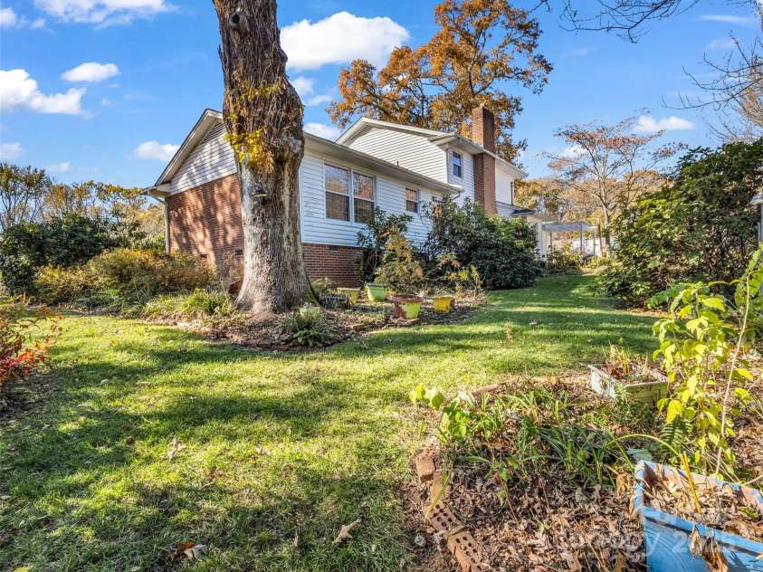 101 Bent Creek Ranch Road, Asheville, NC 28806.  MLS# CAR4318923, YatesRealty ID 4226. Large beautifully landscaped backyard with some mountain views