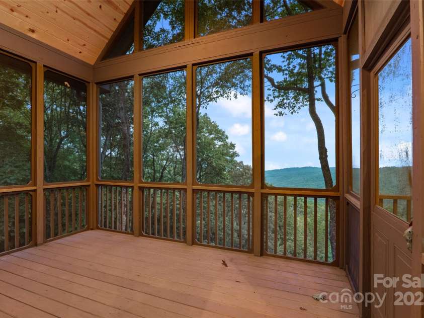 243 Ridgeline Drive, Brevard, NC 28712.  MLS# CAR4313542, YatesRealty ID 4227. Main House Screen Porch