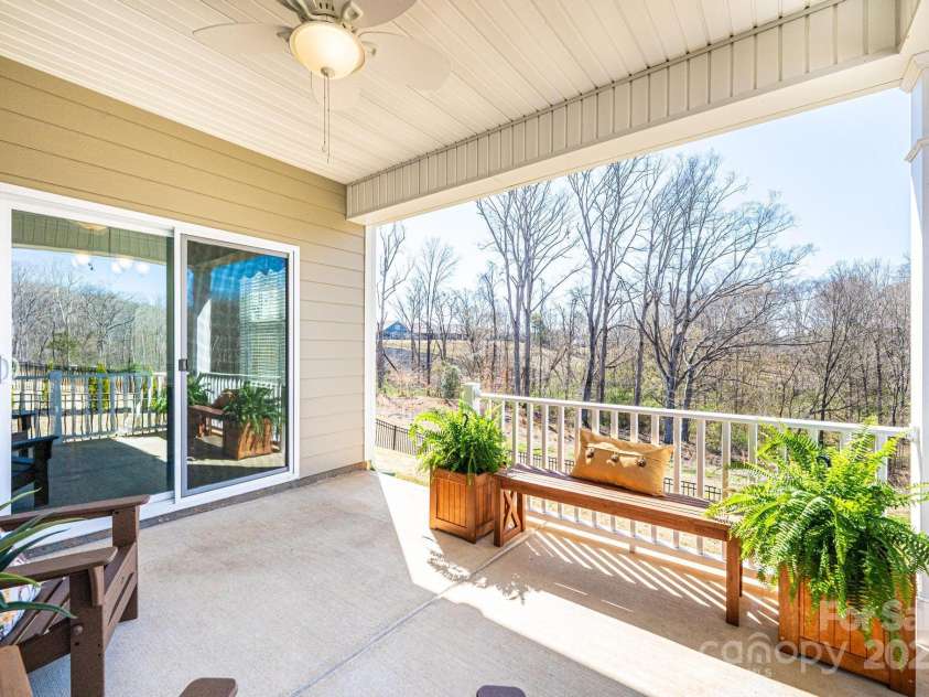 640 Latrobe Drive, Iron Station, NC 28080.  MLS# CAR4238619, YatesRealty ID 4227. Covered porch with great view of the private woods