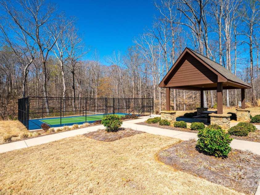 640 Latrobe Drive, Iron Station, NC 28080.  MLS# CAR4238619, YatesRealty ID 4227. Pickle ball and boccia ball. Located at end of cut-de-sac on Latrobe Drive.