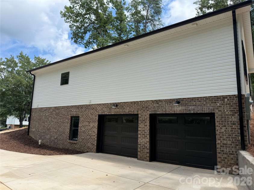 1135 Pinebrook Avenue, Valdese, NC 28690.  MLS# CAR4412091, YatesRealty ID 42284. Huge double garage in the basement