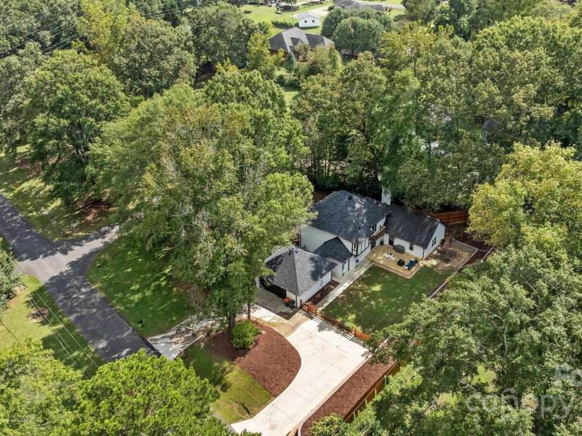 2733 Wellington Street, Rock Hill, SC 29732.  MLS# CAR4185422, YatesRealty ID 4230. Aerial view of side driveway and back yard