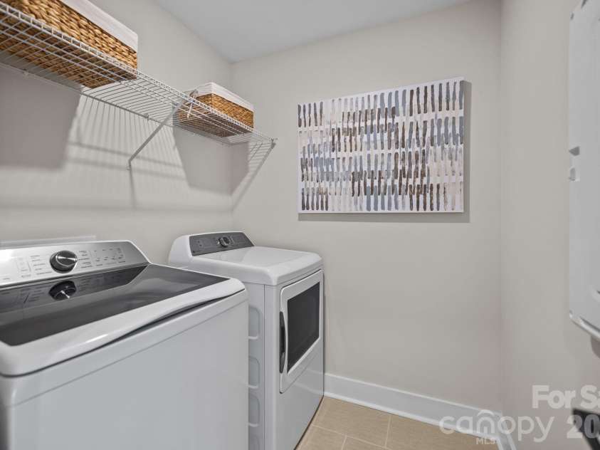 3026 Grandiose Drive, Indian Trail, NC 28079.  MLS# CAR4412254, YatesRealty ID 42300. Second Floor Laundry Room - Model Home Photo for Reference Only.