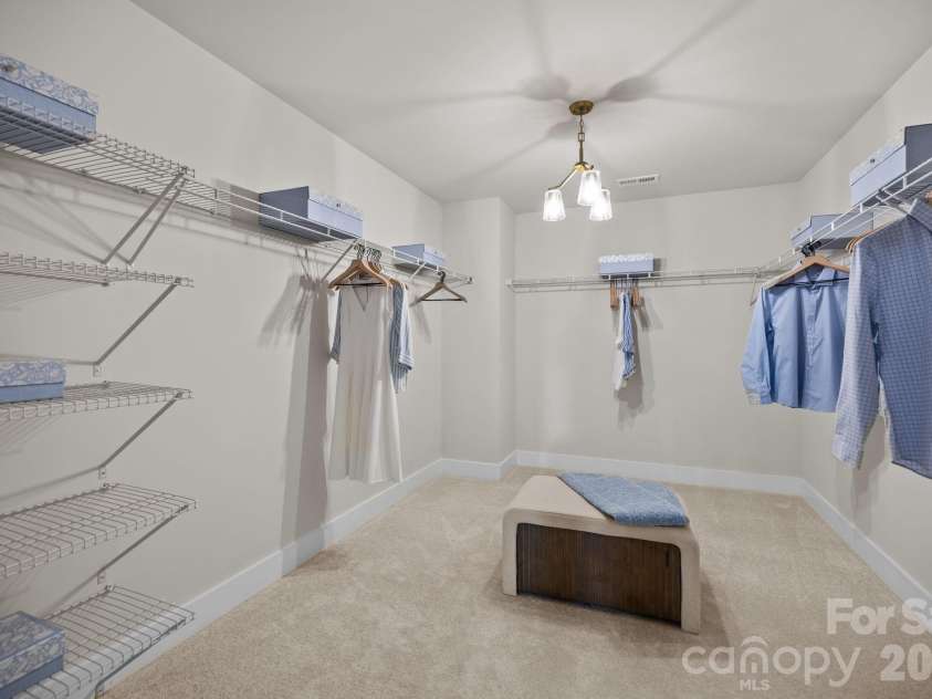 3026 Grandiose Drive, Indian Trail, NC 28079.  MLS# CAR4412254, YatesRealty ID 42300. Second Floor Primary Closet - Model Home Photo for Reference Only