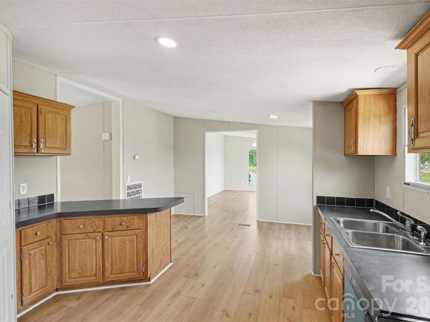 2721 New Salem Road, Monroe, NC 28110.  MLS# CAR4412833, YatesRealty ID 42309. Large kitchen with pantry