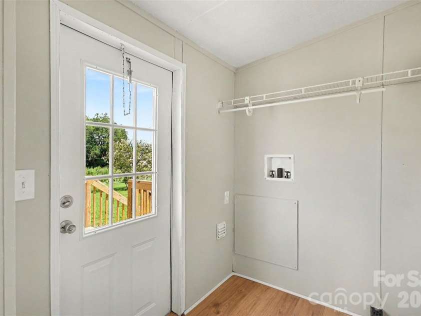 2721 New Salem Road, Monroe, NC 28110.  MLS# CAR4412833, YatesRealty ID 42309. Laundry room off kitchen