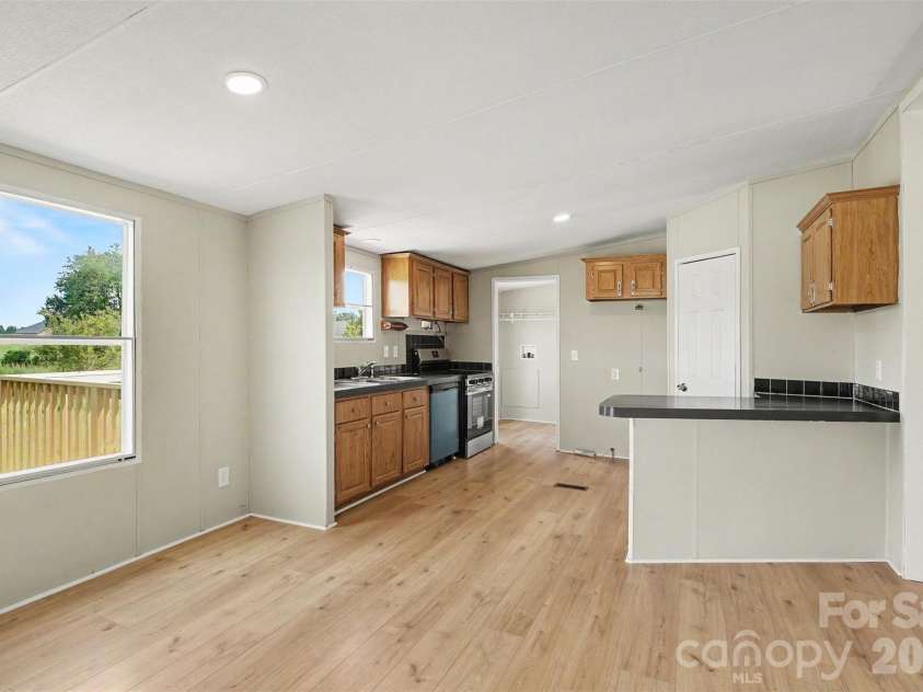 2721 New Salem Road, Monroe, NC 28110.  MLS# CAR4412833, YatesRealty ID 42309. Living open to kitchen