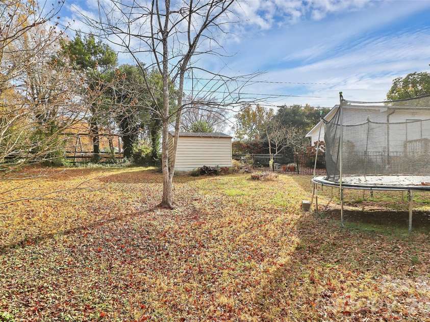 7501 Folger Drive, Charlotte, NC 28226.  MLS# CAR4325075, YatesRealty ID 4232. Backyard and shed