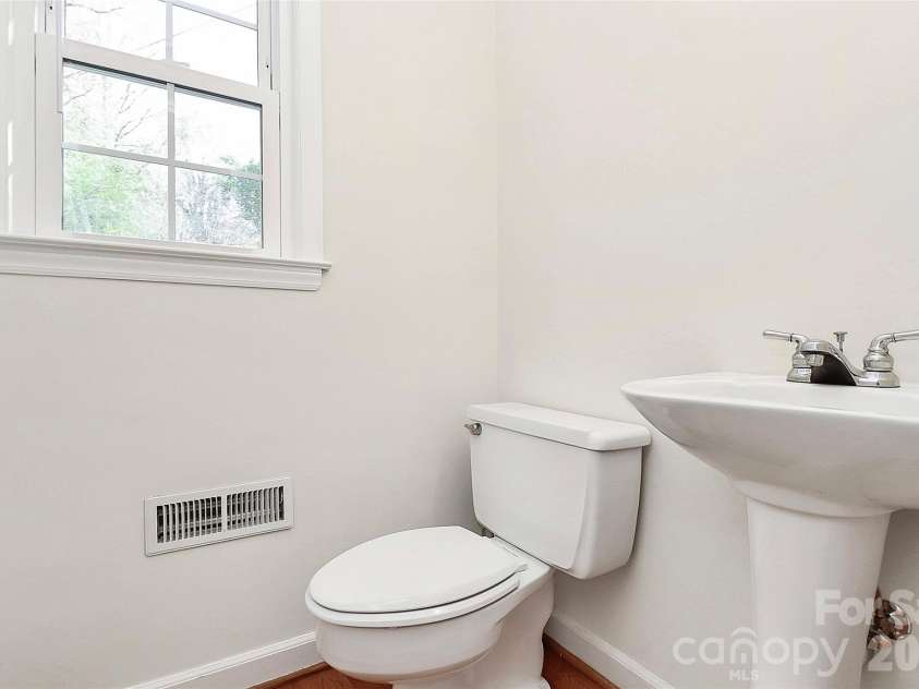 7501 Folger Drive, Charlotte, NC 28226.  MLS# CAR4325075, YatesRealty ID 4232. Half bath near kitchen and side entrance
