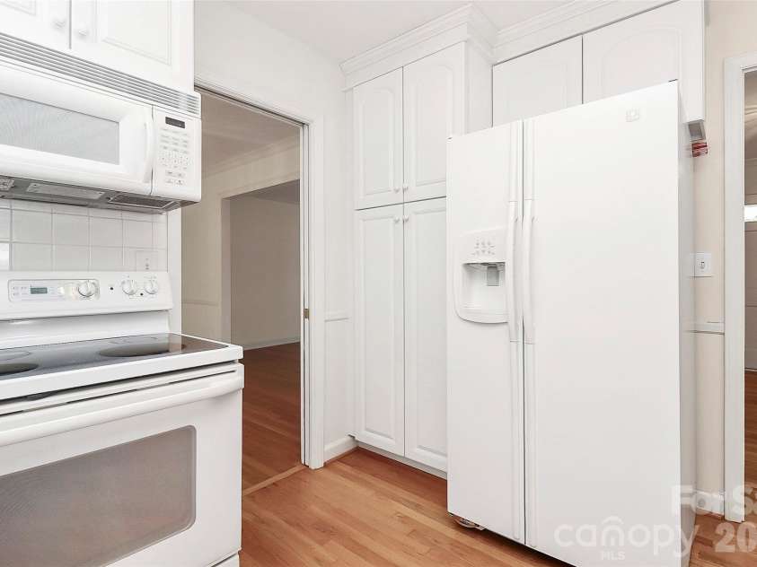 7501 Folger Drive, Charlotte, NC 28226.  MLS# CAR4325075, YatesRealty ID 4232. Kitchen- fridge remains