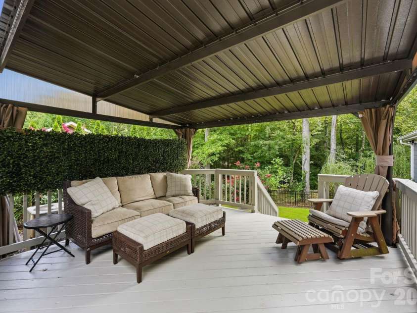 18609 Boulder Rock Loop, Davidson, NC 28036.  MLS# CAR4411962, YatesRealty ID 42335. A newly added canopy creates a comfortable covered area for relaxing and entertaining.