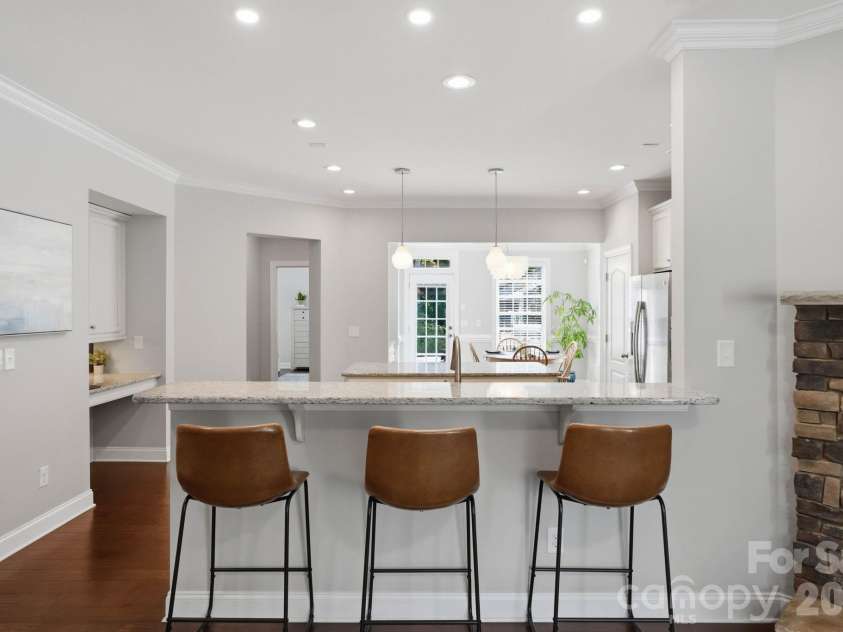 18609 Boulder Rock Loop, Davidson, NC 28036.  MLS# CAR4411962, YatesRealty ID 42335. Additional breakfast bar just off the kitchen provides seating for three, a natural gathering spot for casual meals or conversation.