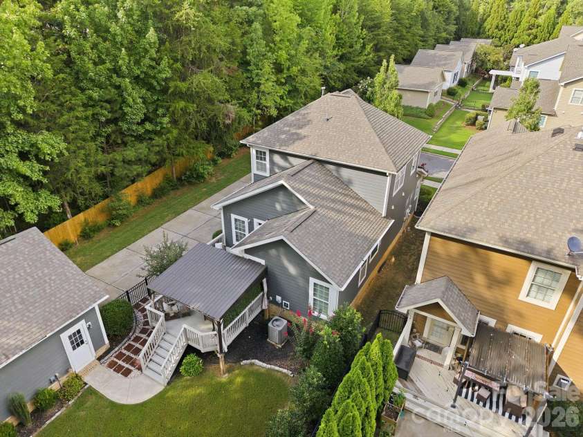 18609 Boulder Rock Loop, Davidson, NC 28036.  MLS# CAR4411962, YatesRealty ID 42335. An angled aerial perspective captures the home’s charming setting and abundant natural beauty.