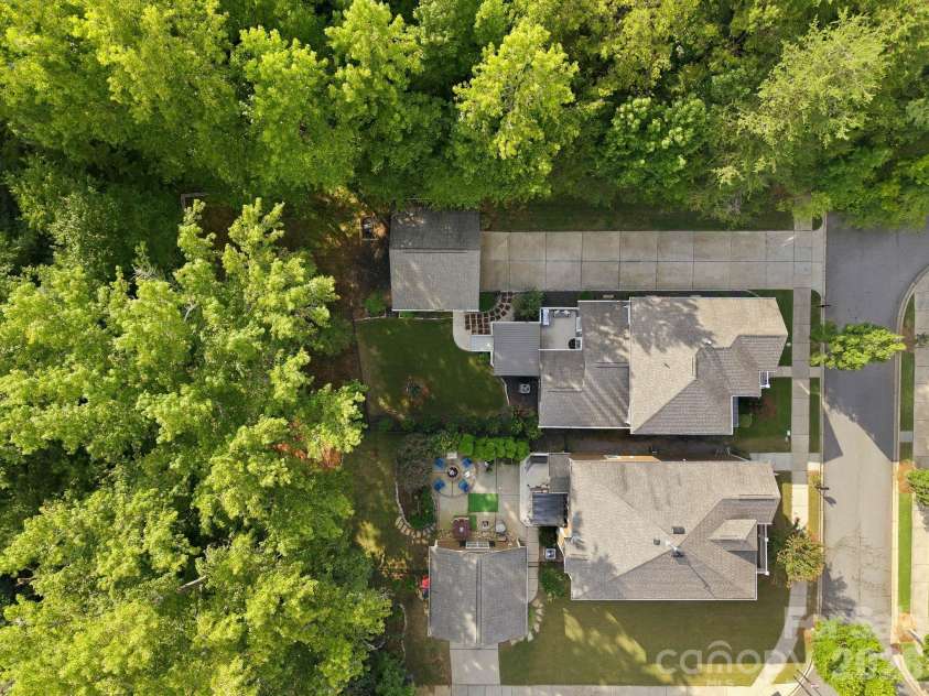 18609 Boulder Rock Loop, Davidson, NC 28036.  MLS# CAR4411962, YatesRealty ID 42335. Bird’s-eye view highlights the home’s private setting, lush landscaping, and wooded surroundings.