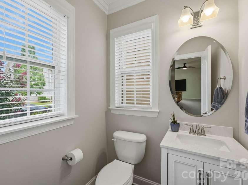 18609 Boulder Rock Loop, Davidson, NC 28036.  MLS# CAR4411962, YatesRealty ID 42335. Clean and bright, main level powder room provides added convenience for guests.