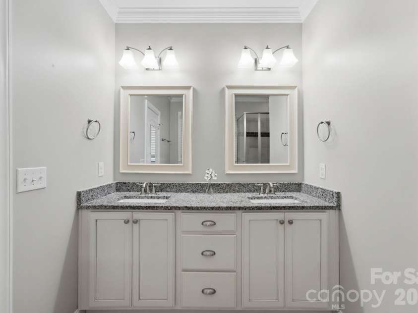 18609 Boulder Rock Loop, Davidson, NC 28036.  MLS# CAR4411962, YatesRealty ID 42335. Dual-sink primary vanity offers generous counter space and storage.