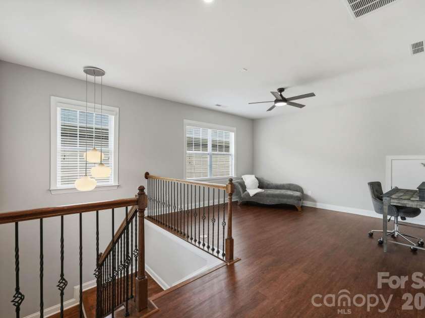18609 Boulder Rock Loop, Davidson, NC 28036.  MLS# CAR4411962, YatesRealty ID 42335. Expansive upper-level bonus room offers flexible space for an office, media room, or recreation area.