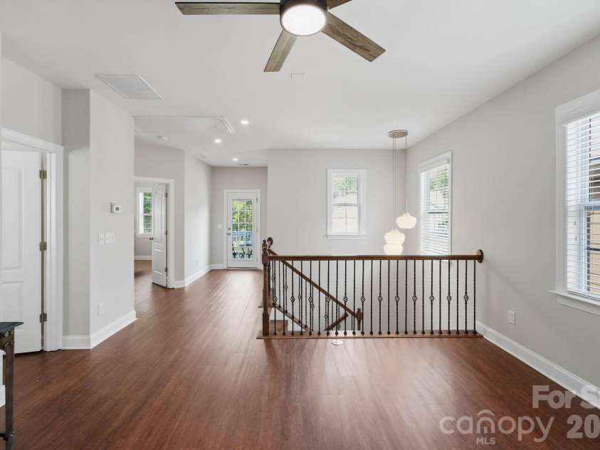 18609 Boulder Rock Loop, Davidson, NC 28036.  MLS# CAR4411962, YatesRealty ID 42335. Open upper-level landing provides additional flexible living space and access to the private balcony.