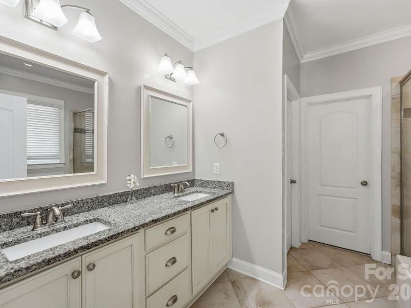 18609 Boulder Rock Loop, Davidson, NC 28036.  MLS# CAR4411962, YatesRealty ID 42335. The primary bath connects directly to a generously sized walk-in closet for everyday convenience.