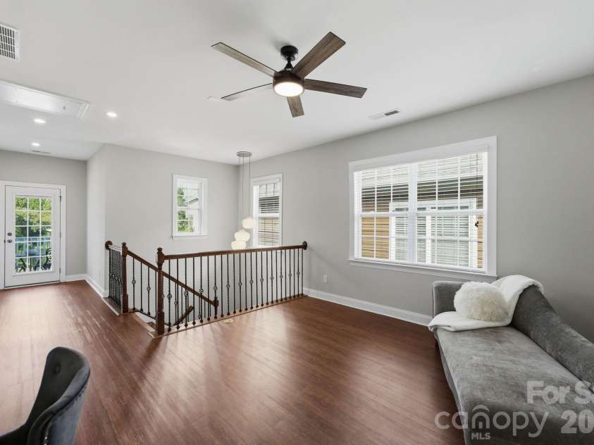 18609 Boulder Rock Loop, Davidson, NC 28036.  MLS# CAR4411962, YatesRealty ID 42335. Versatile upstairs flex space provides plenty of room to create a second living area tailored to your needs.