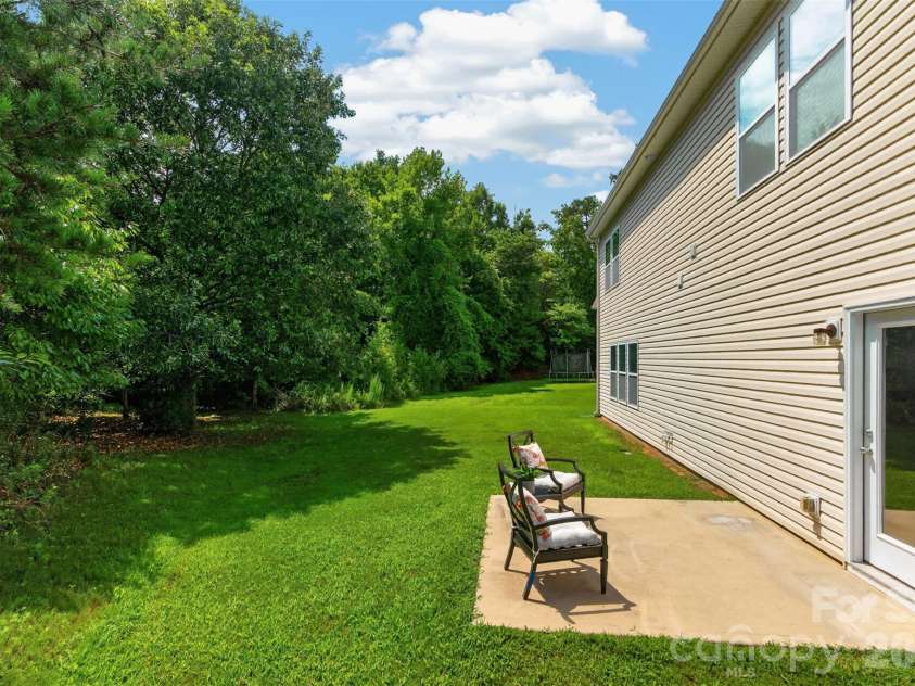3010 Gilroy Drive, Fort Mill, SC 29707.  MLS# CAR4411123, YatesRealty ID 42343. Private and wooded backyard
