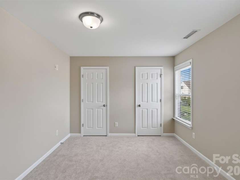 3010 Gilroy Drive, Fort Mill, SC 29707.  MLS# CAR4411123, YatesRealty ID 42343. Third floor bedroom with two closets