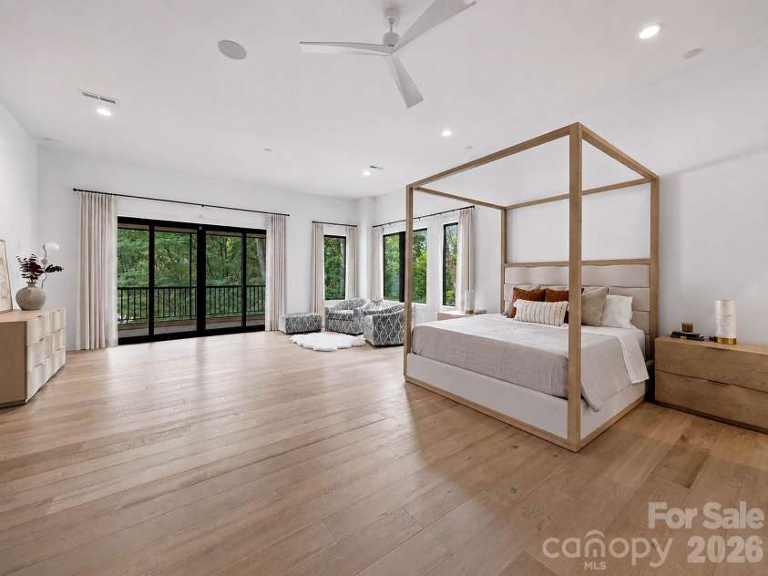 13702 Sage Thrasher Lane, Charlotte, NC 28278.  MLS# CAR4405841, YatesRealty ID 42347. Primary suite speaks for itself- linear fireplace and a private balcony