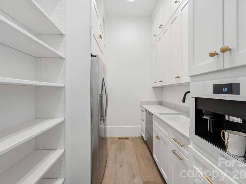 13702 Sage Thrasher Lane, Charlotte, NC 28278.  MLS# CAR4405841, YatesRealty ID 42347. Scullery with a built in Miele coffee maker.