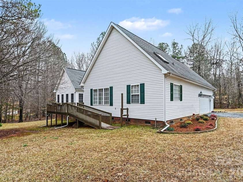 6619 Loblolly Circle, Waxhaw, NC 28173.  MLS# CAR4341573, YatesRealty ID 4235. Back left of home with ramp to Deck