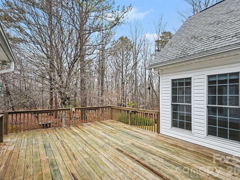 6619 Loblolly Circle, Waxhaw, NC 28173.  MLS# CAR4341573, YatesRealty ID 4235. Deck between Primary BR and Sunroom and viewable from Kitchen window over sink