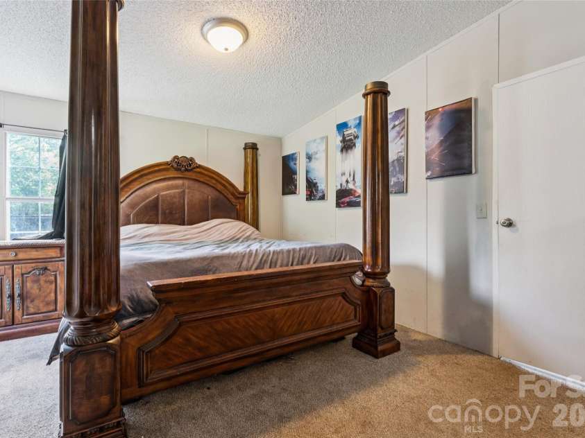 912 Grace Drive, Stanley, NC 28164.  MLS# CAR4406122, YatesRealty ID 42356. Large Master bedroom..