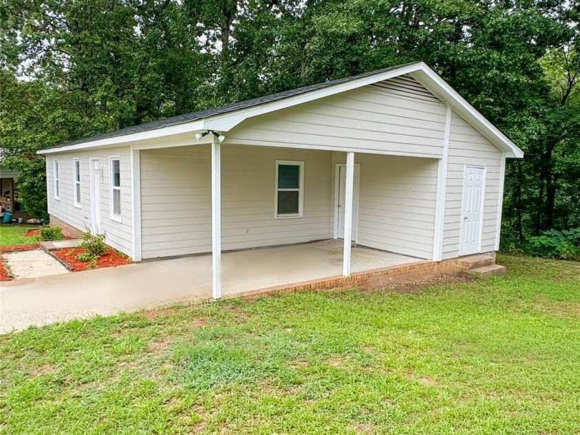 705 Creekridge Drive, Monroe, NC 28110.  MLS# CAR4411877, YatesRealty ID 42360. Side Front of House
