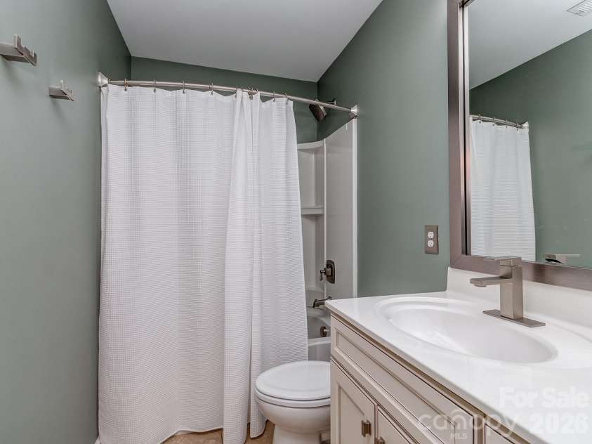 5951 Carrollton Lane, Charlotte, NC 28210.  MLS# CAR4409578, YatesRealty ID 42367. Hall bath, updated fixtures