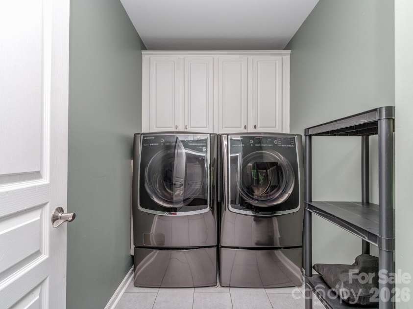 5951 Carrollton Lane, Charlotte, NC 28210.  MLS# CAR4409578, YatesRealty ID 42367. Laundry room, updated tile flooring